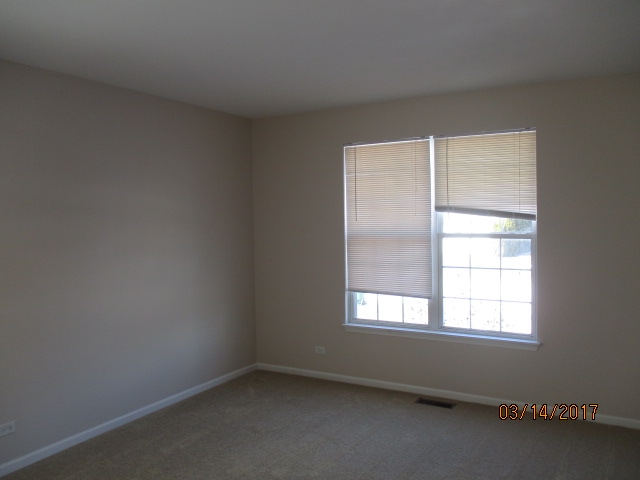204 Wilkins Road Sycamore, IL 60178 - Photo 5 of 24 an empty room with a window