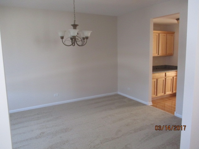 204 Wilkins Road Sycamore, IL 60178 - Photo 6 of 24 a view of an empty room with a window
