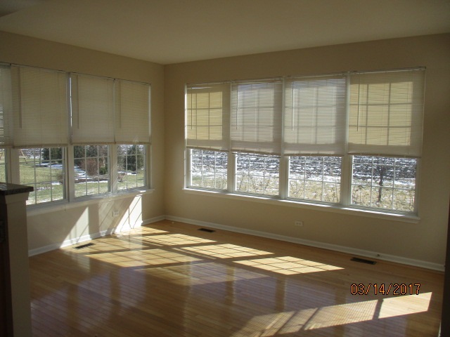 204 Wilkins Road Sycamore, IL 60178 - Photo 9 of 24 a view of a livingroom with wooden floor and a window