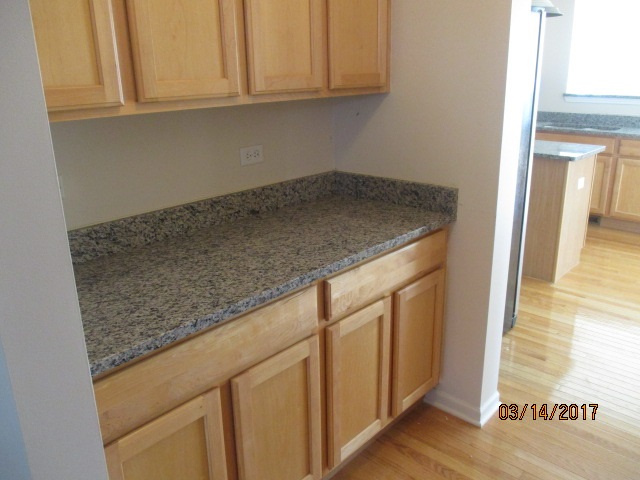 204 Wilkins Road Sycamore, IL 60178 - Photo 10 of 24 a kitchen with granite countertop white cabinets and a sink