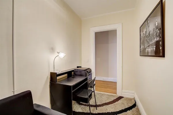 a room with a table and mirror