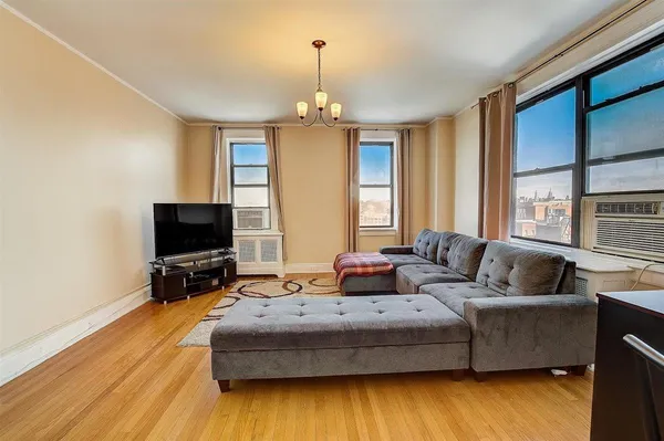a living room with fireplace furniture and a flat screen tv