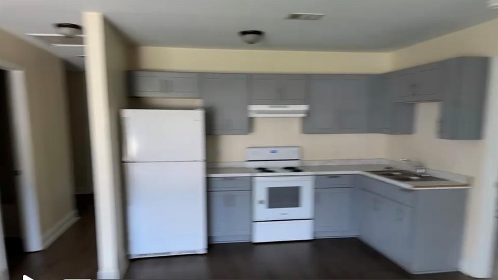 131 Ronald Pride Boulevard, Unit A Fort Valley, GA 31030 - Photo 2 of 8 a kitchen with a stove and a refrigerator