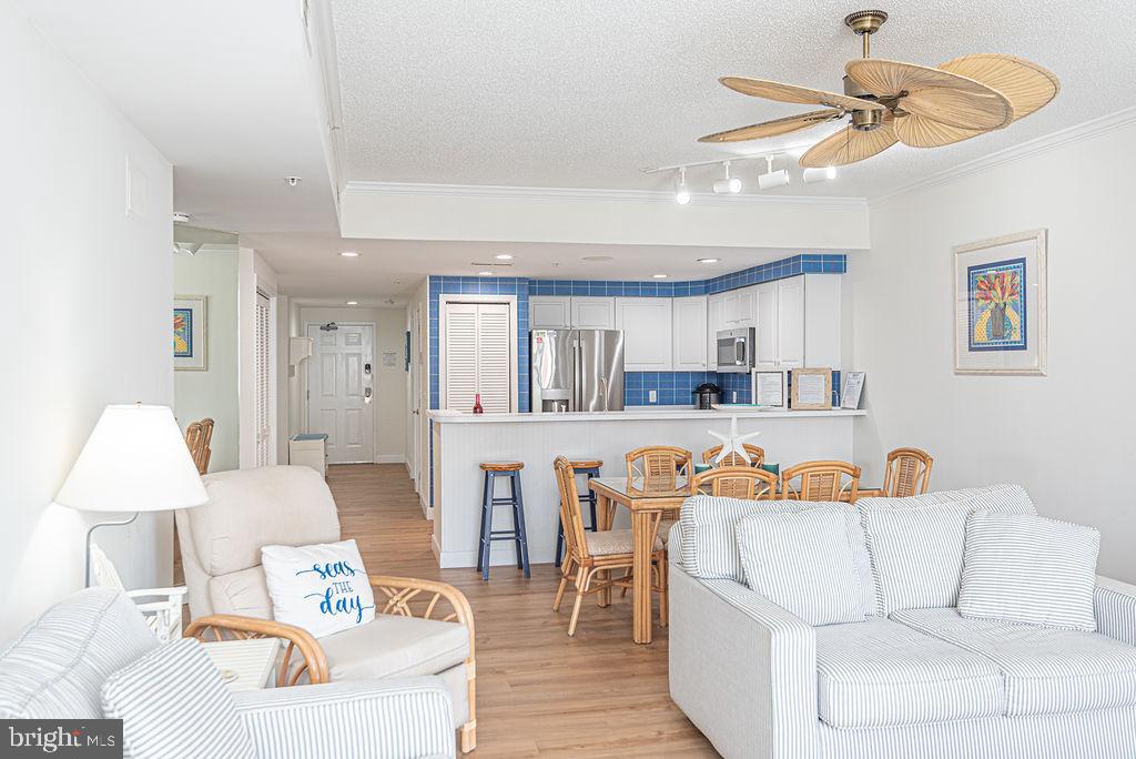 9 90th Street, Unit 102 Ocean City, MD 21842 - Photo 15 of 42 a living room with furniture a table and chairs