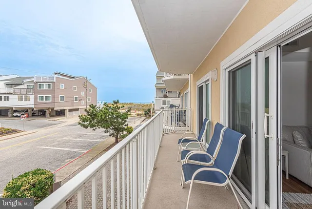 a view of a balcony with chairs