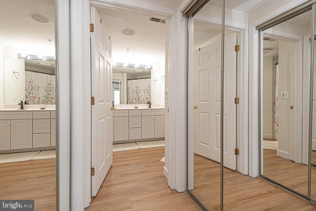 9 90th Street, Unit 102 Ocean City, MD 21842 - Photo 23 of 42 a view of a bathroom with a shower and a sink