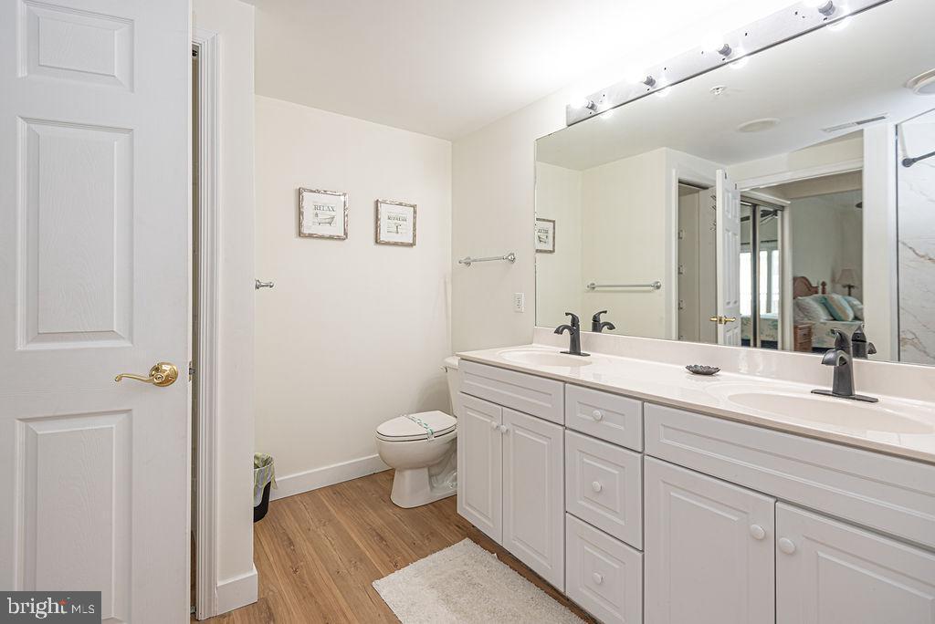 9 90th Street, Unit 102 Ocean City, MD 21842 - Photo 28 of 42 a spacious bathroom with a sink and a toilet