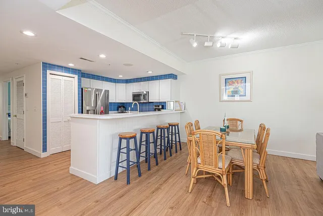 a living room with furniture a window and a chandelier