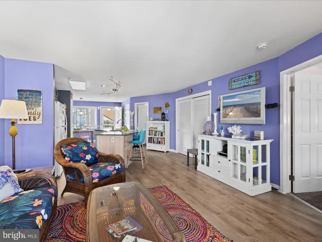 a living room with furniture and book shelf