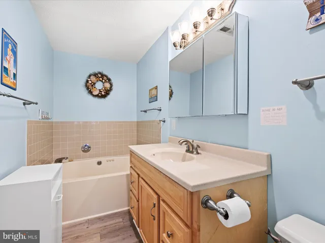 a bathroom with a sink a toilet and a bathtub