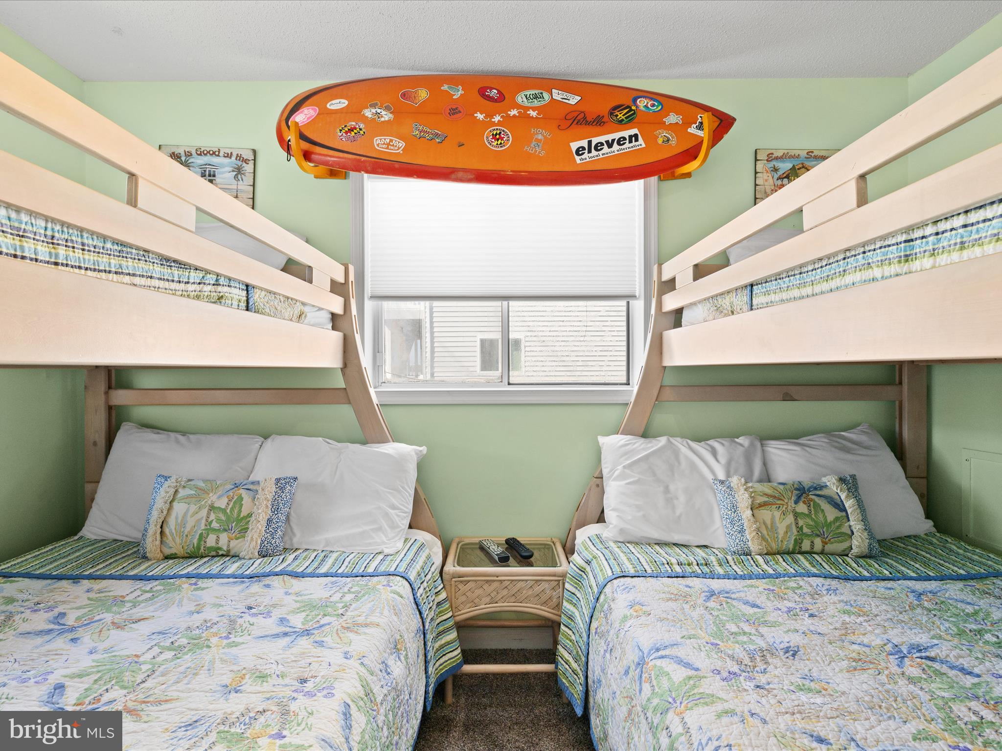 5500 Coastal Highway, Unit B23003 Ocean City, MD 21842 - Photo 17 of 26 a bedroom with two beds and a window