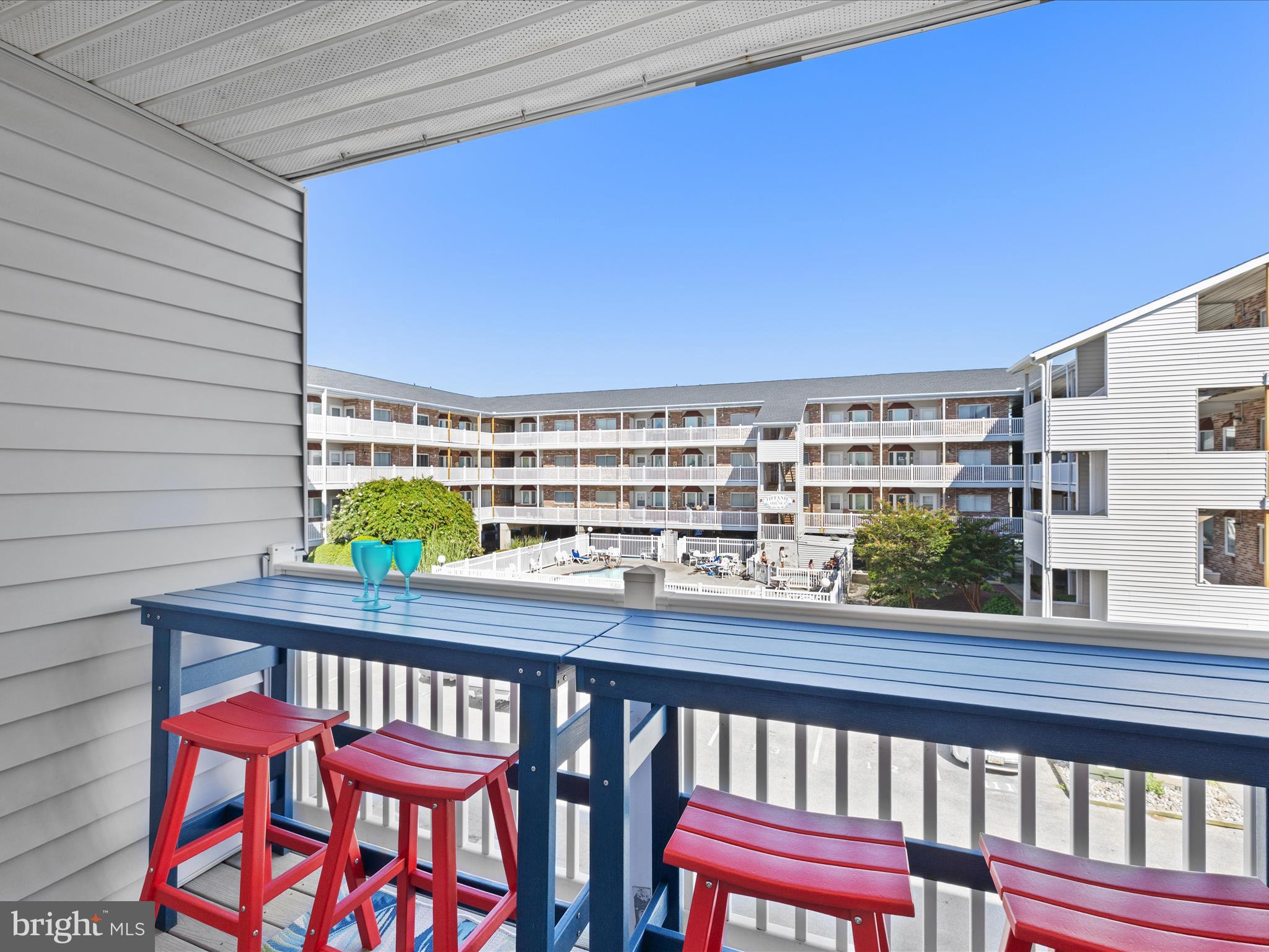 5500 Coastal Highway, Unit B23003 Ocean City, MD 21842 - Photo 20 of 26 a view of a chairs and table in the balcony