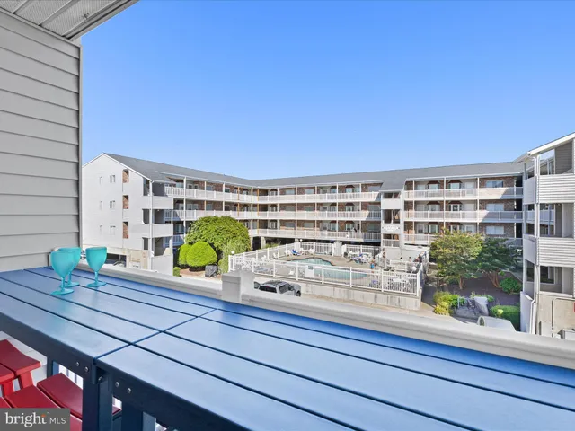 a view of kitchen with granite countertop cabinets