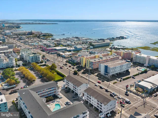 an aerial view of a city and ocean view
