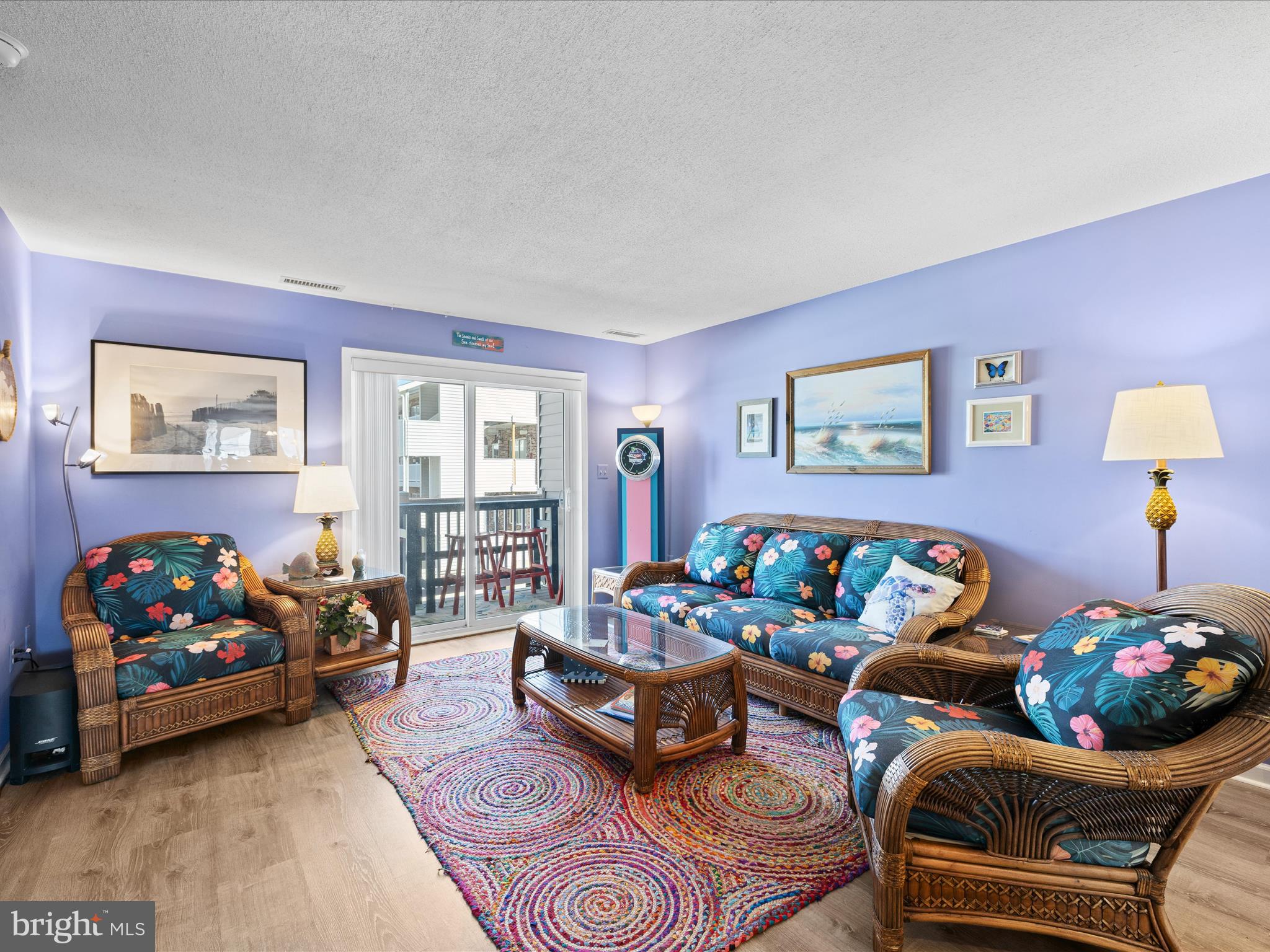 5500 Coastal Highway, Unit B23003 Ocean City, MD 21842 - Photo 10 of 26 a living room with furniture and a potted plant