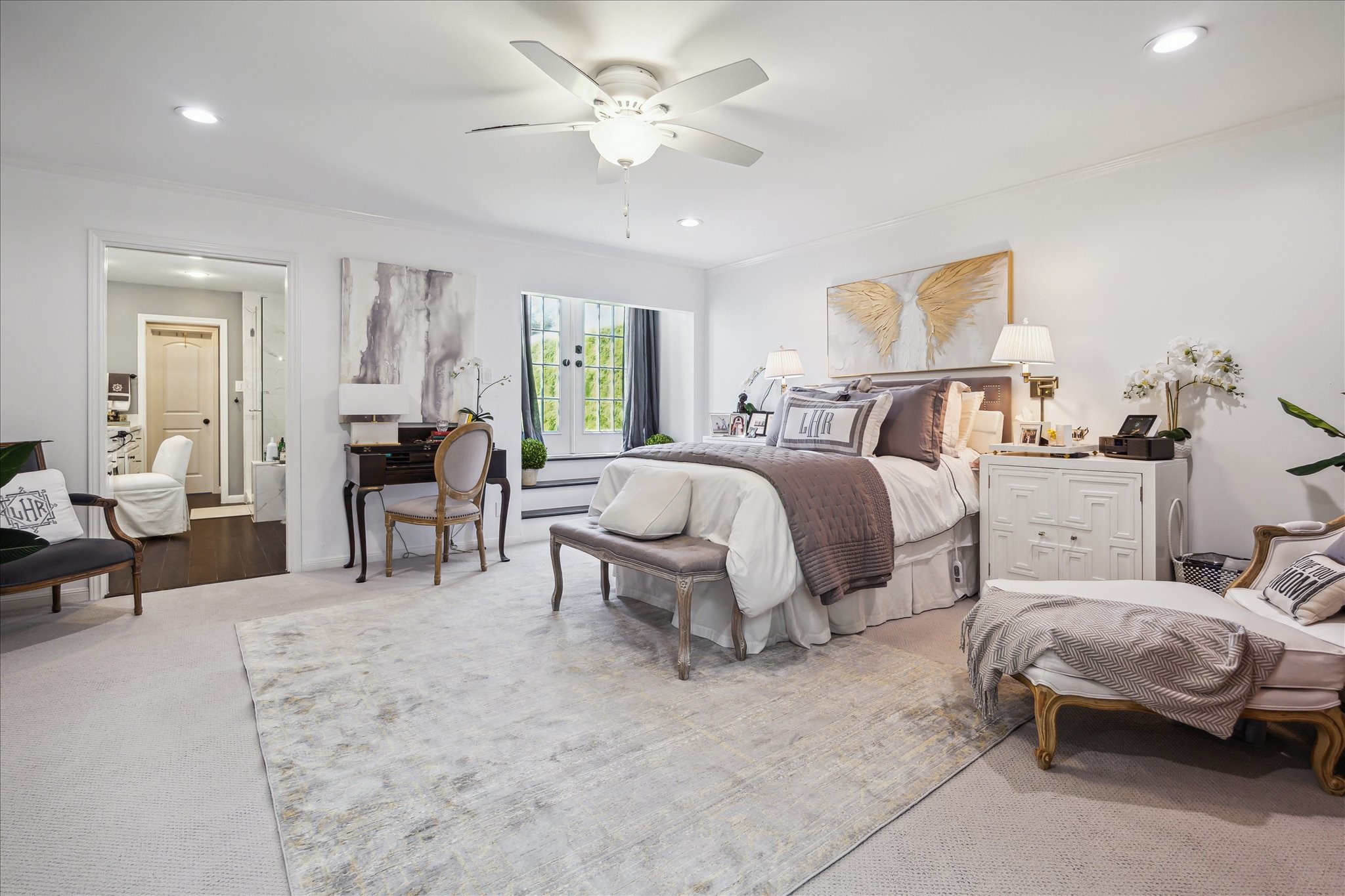 2220 Fulham Court Houston, TX 77063 - Photo 12 of 21 This view of the spacious primary bedroom suite highlights the elegant French doors that open to a charming rooftop terrace—an ideal retreat for morning coffee or evening relaxation.