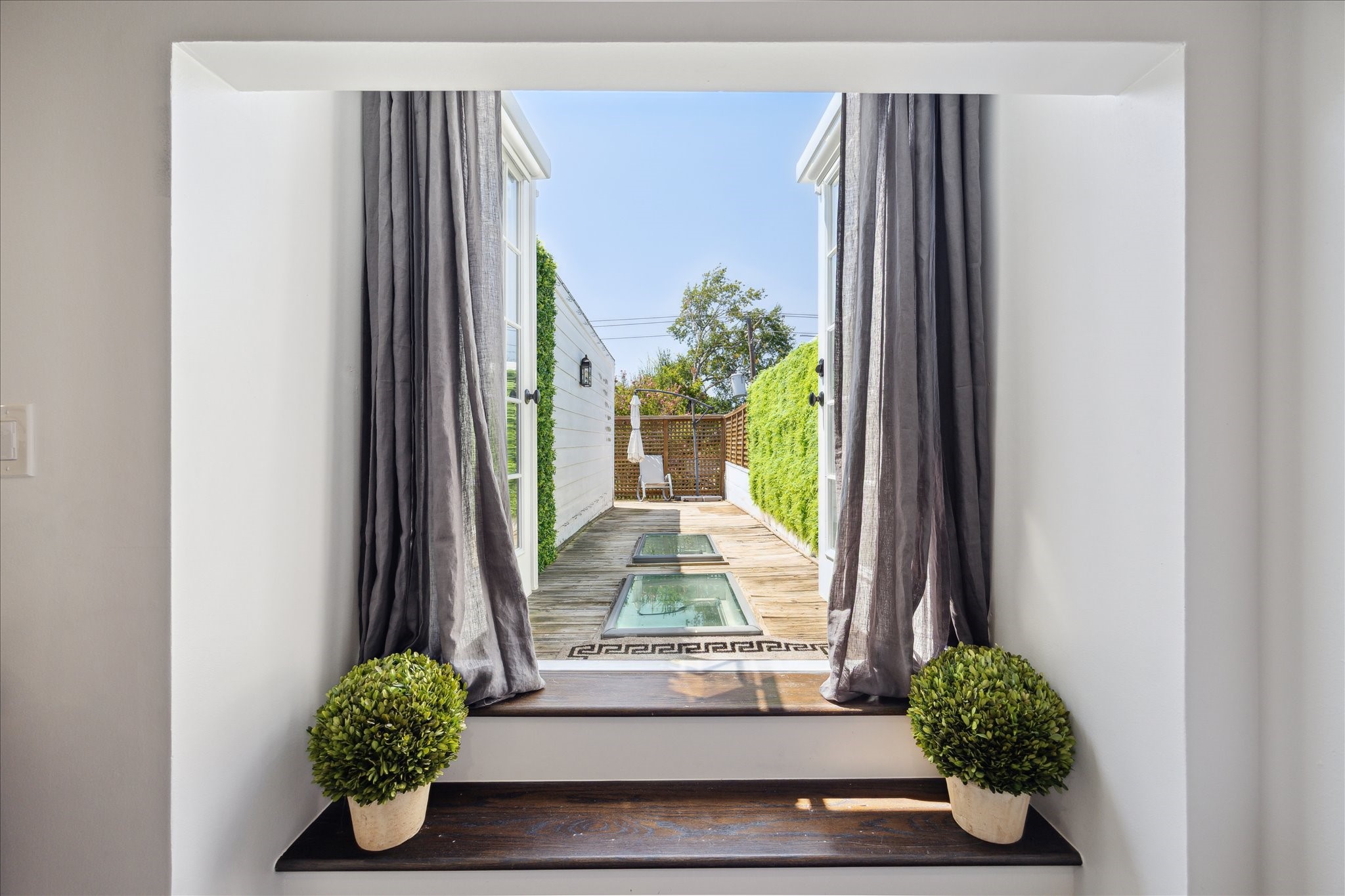 2220 Fulham Court Houston, TX 77063 - Photo 16 of 21 Serene rooftop terrace view from the expansive primary suite—an inviting retreat just steps from your bedroom.