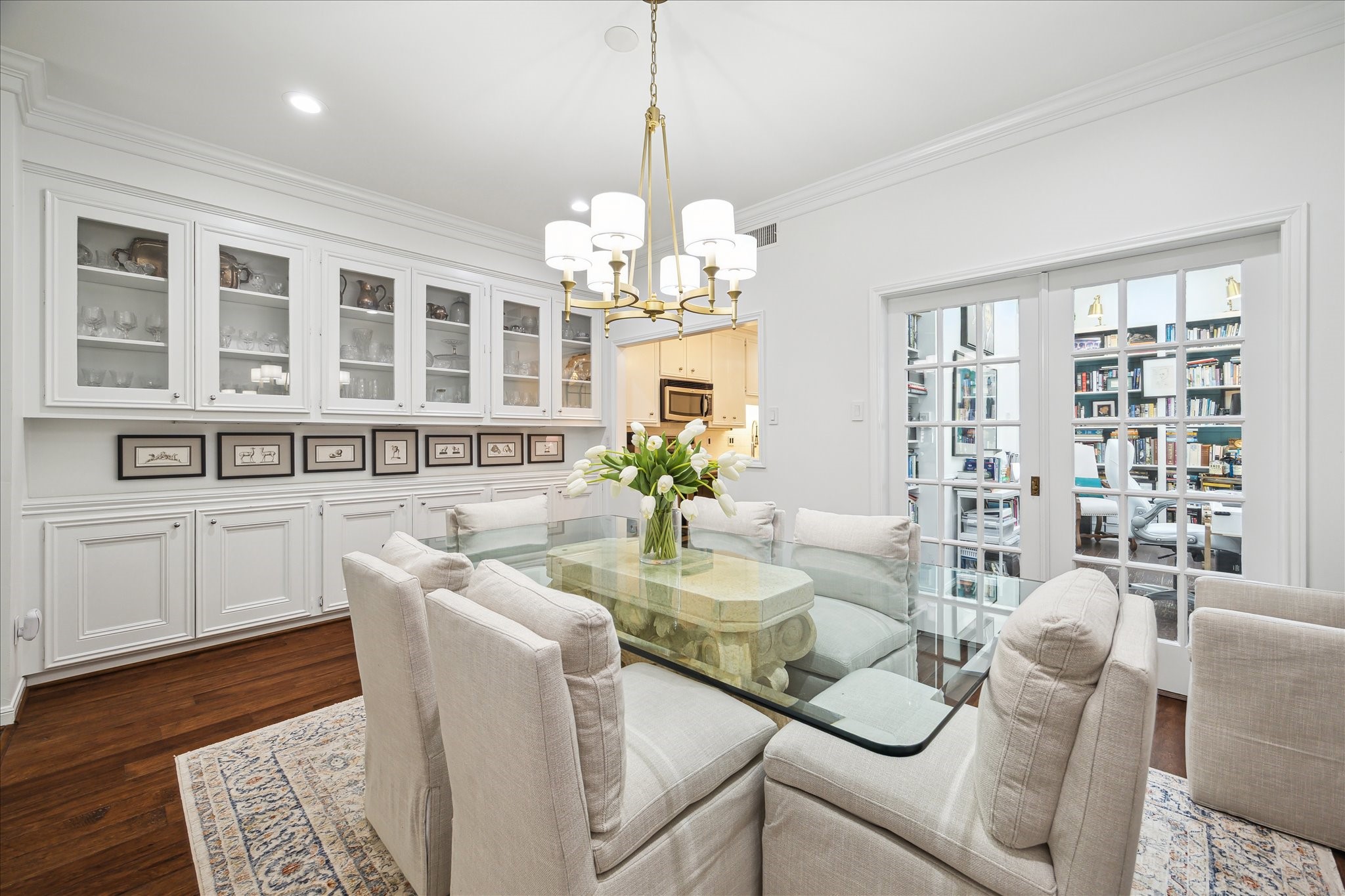 2220 Fulham Court Houston, TX 77063 - Photo 4 of 21 An inviting view from the dining room reveals custom built-in cabinetry that leads into the kitchen — perfect for showcasing china, barware, and timeless taste.