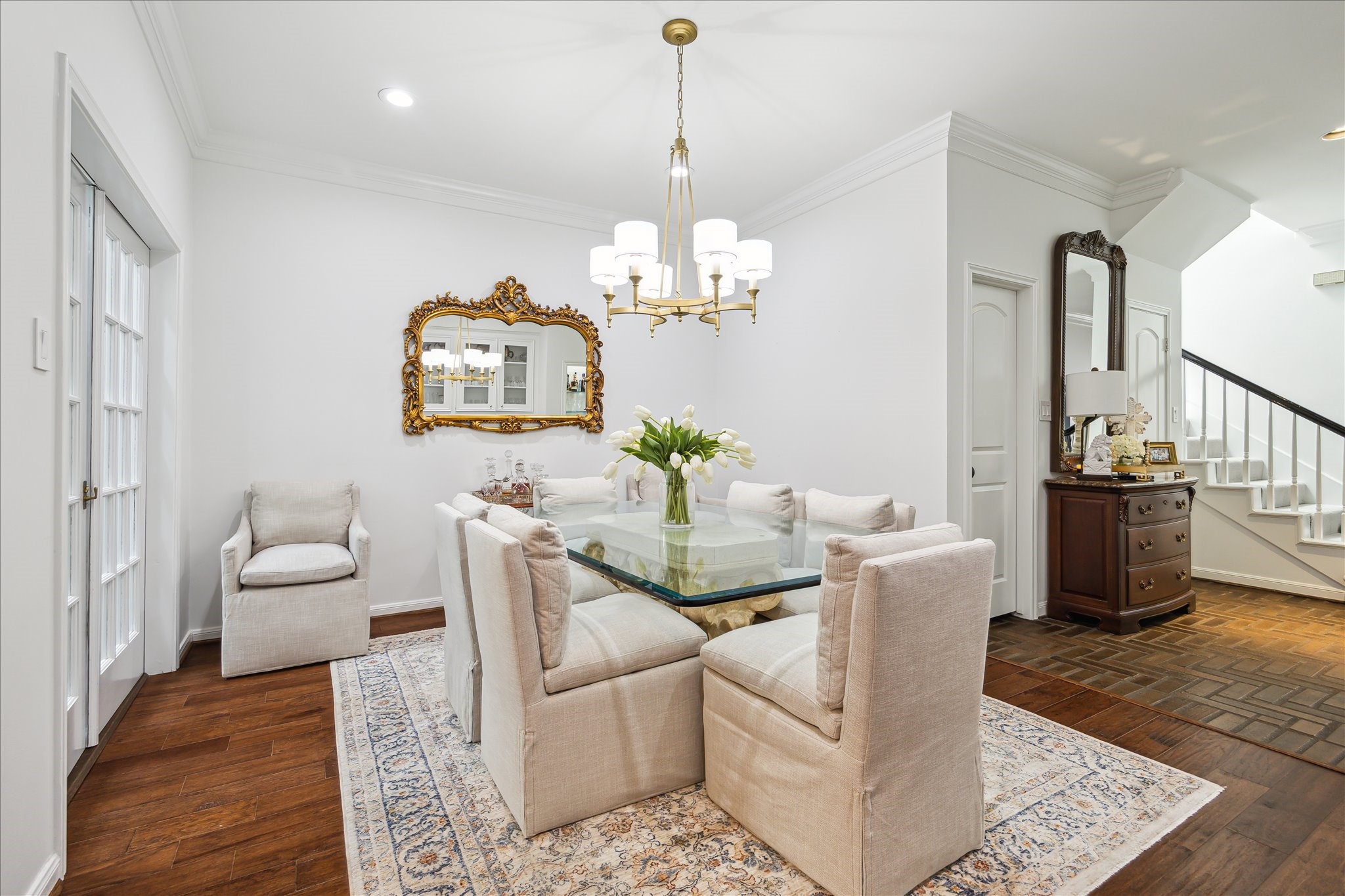2220 Fulham Court Houston, TX 77063 - Photo 5 of 21 Another view of the dining room with a view of the stairs and powder bath area.