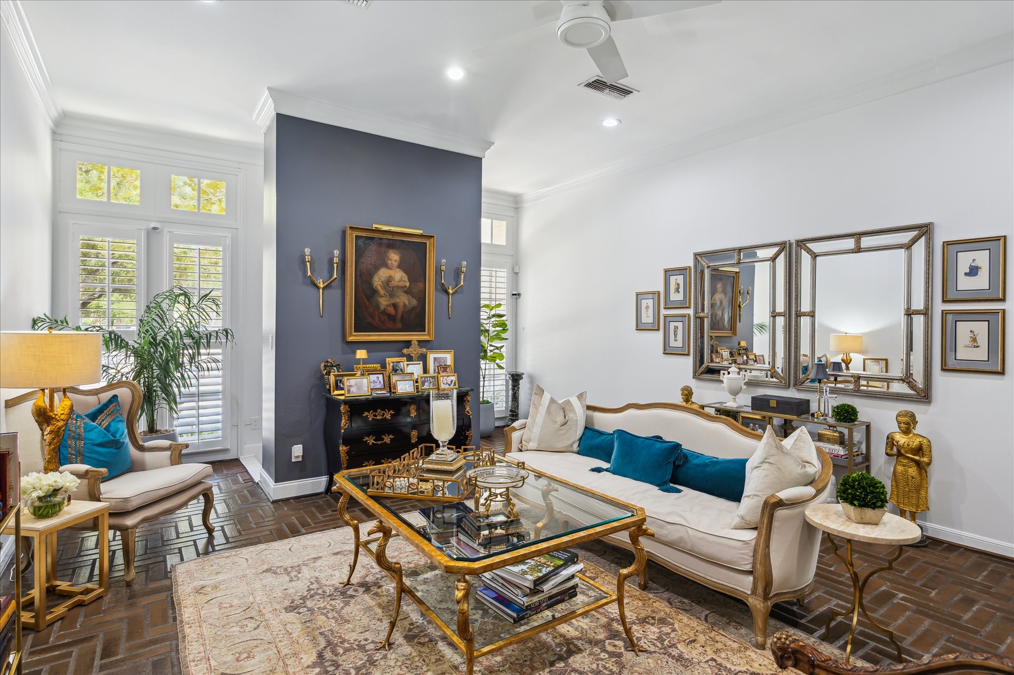 2220 Fulham Court Houston, TX 77063 - Photo 8 of 21 Another view of the living room and welcoming entry show the large front windows that fill the space with natural light and offer a charming view of the tree-lined street.