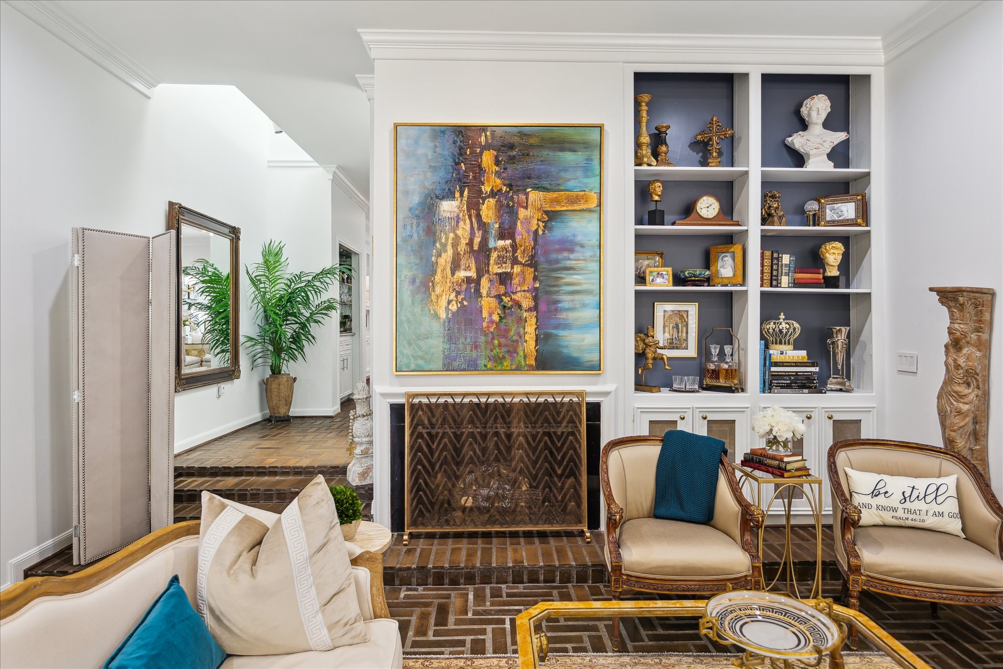 2220 Fulham Court Houston, TX 77063 - Photo 9 of 21 Another angle of the inviting living room showcases the beautiful fireplace and custom built-in shelves—perfect for both relaxing and entertaining.