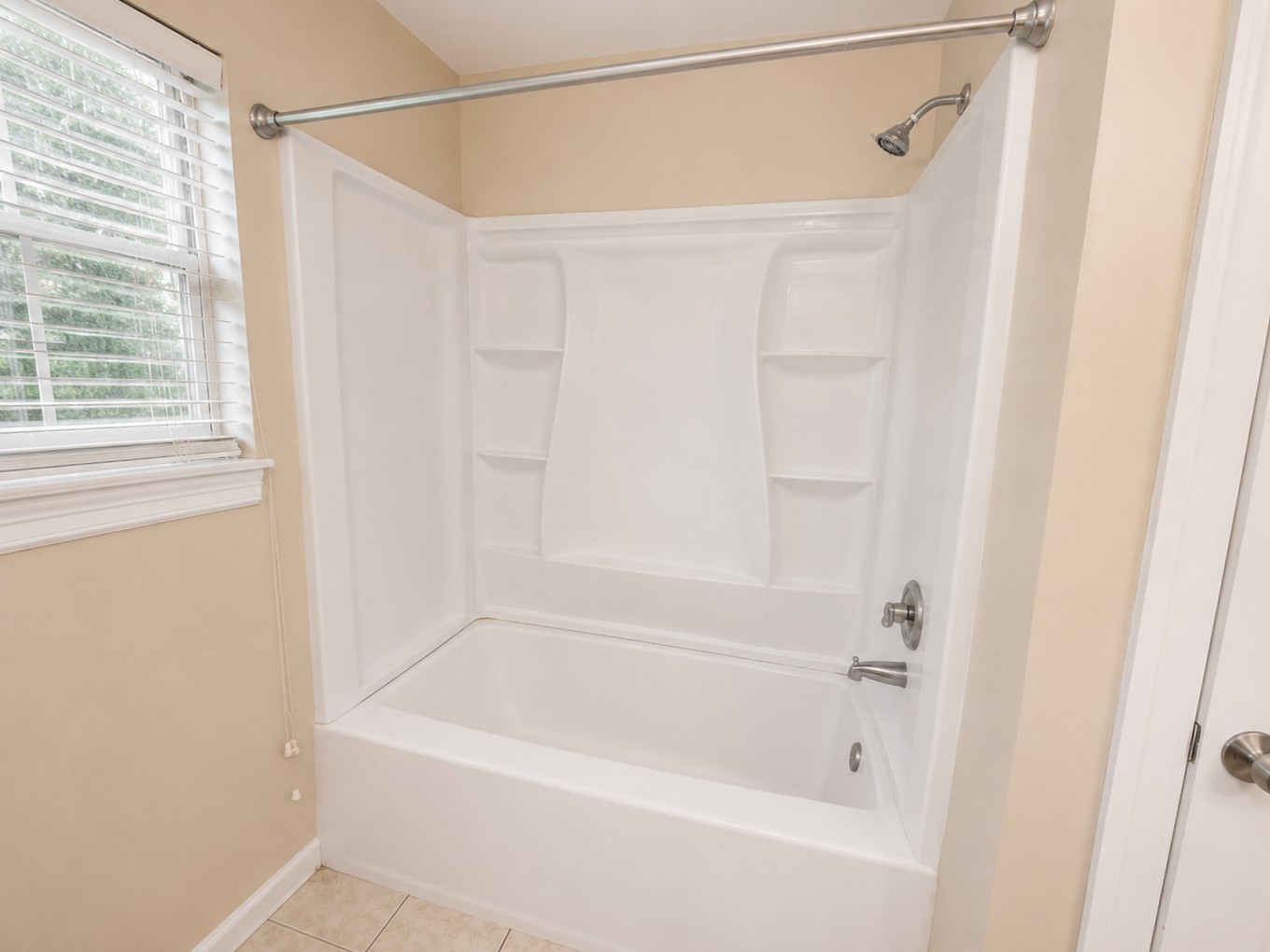 12926 Abalone Way Houston, TX 77044 - Photo 11 of 15 a bathroom with a shower and a bath tub