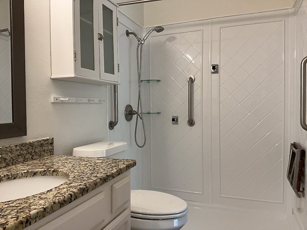 16912 Village Oak Loop Austin, TX 78717 - Photo 9 of 15 a bathroom with a granite countertop sink toilet and shower