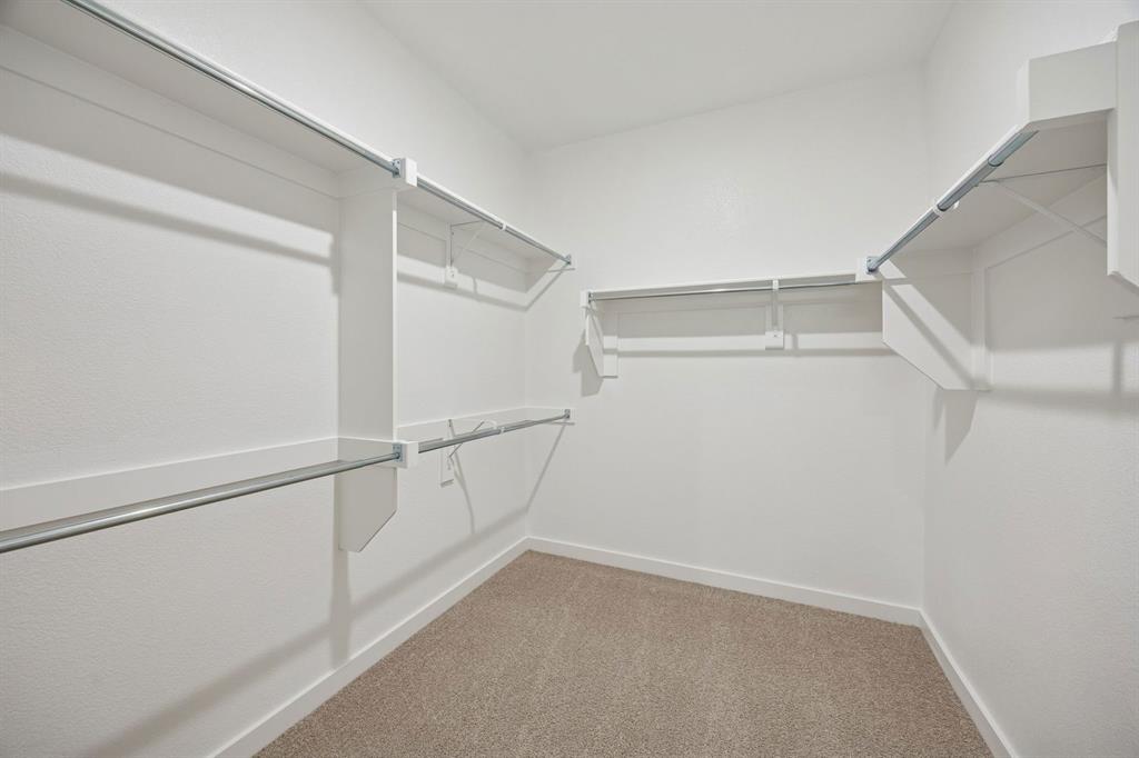 1432 Companero Street Haslet, TX 76052 - Photo 20 of 36 Primary Closet in the Masters home plan by Trophy Signature Homes – REPRESENTATIVE PHOTO
