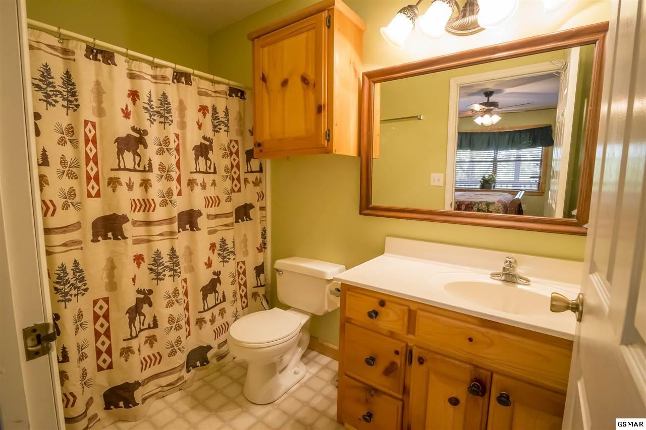 3510 Jakes Ridge Sevierville, TN 37862 - Photo 25 of 29 a bathroom with a sink and a mirror