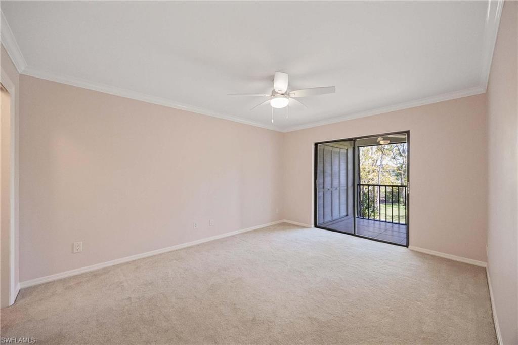 1608 Spoonbill Lane, Unit B Naples, FL 34105 - Photo 13 of 31 a view of an empty room with a window