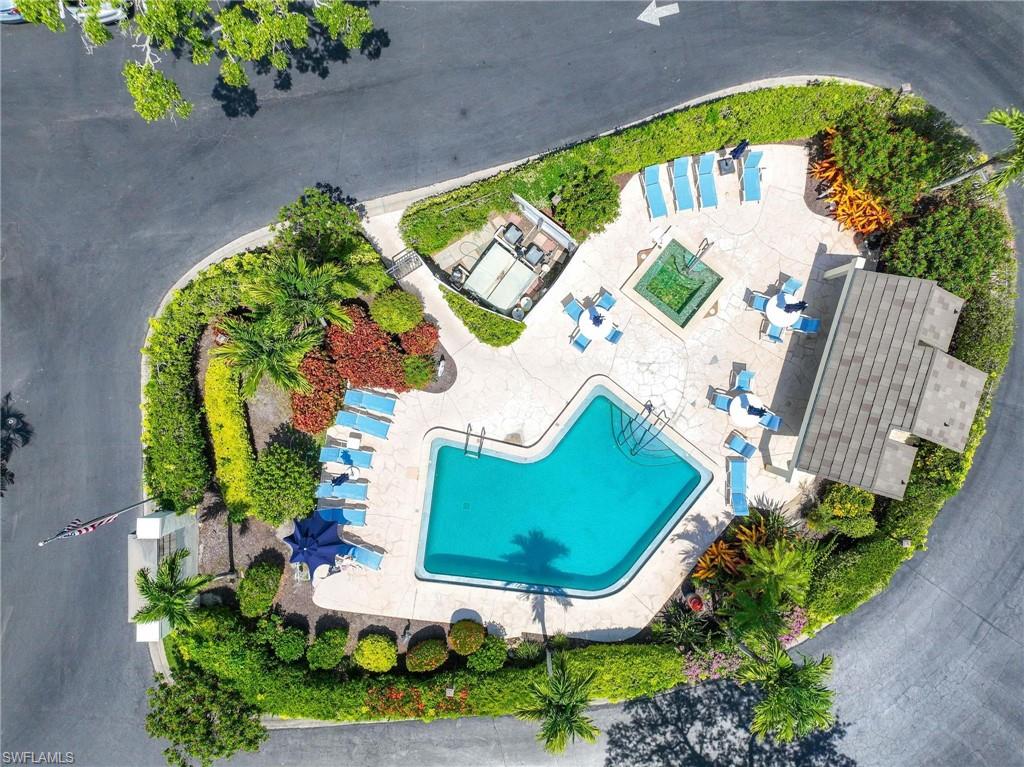 1608 Spoonbill Lane, Unit B Naples, FL 34105 - Photo 23 of 31 an aerial view of a house a yard and outdoor seating