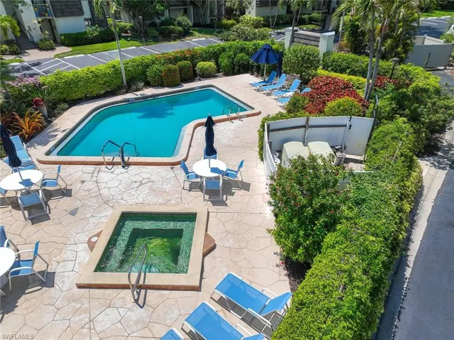 an aerial view of a house with garden space and lake view