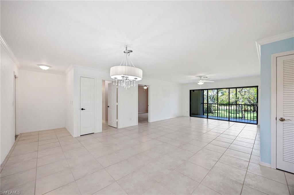 1608 Spoonbill Lane, Unit B Naples, FL 34105 - Photo 5 of 31 a view of an empty room with a window