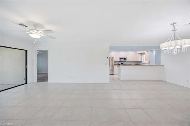a view of a kitchen with electric appliances