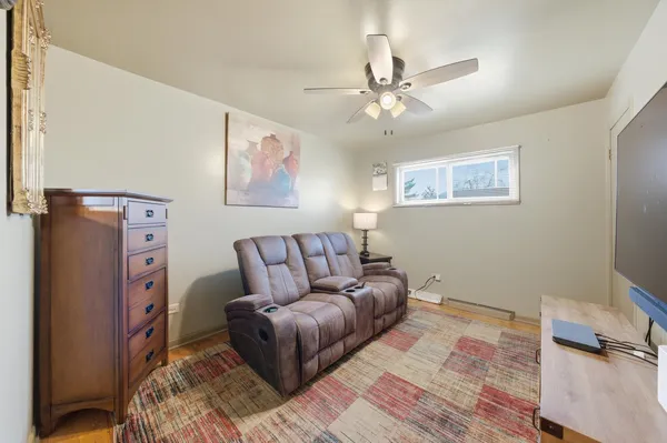 a living room with furniture and a rug