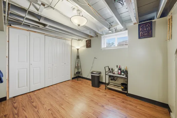 a view of a storage & utility room with wooden floor