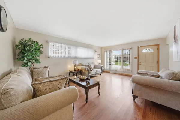 a living room with furniture and a large window