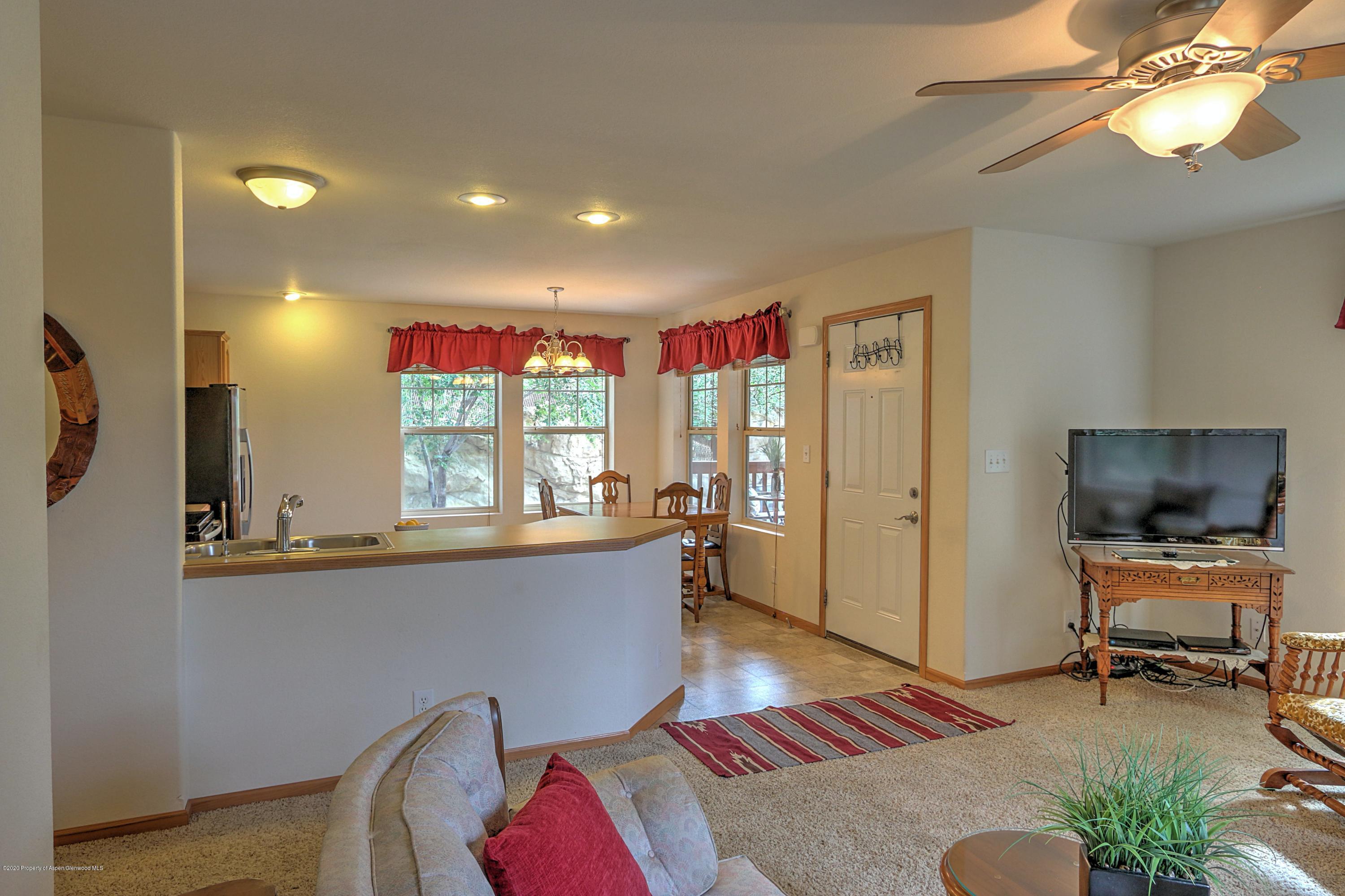 3045 Highway 325 Rifle, CO 81650 - Photo 6 of 35 a living room with furniture and a large window