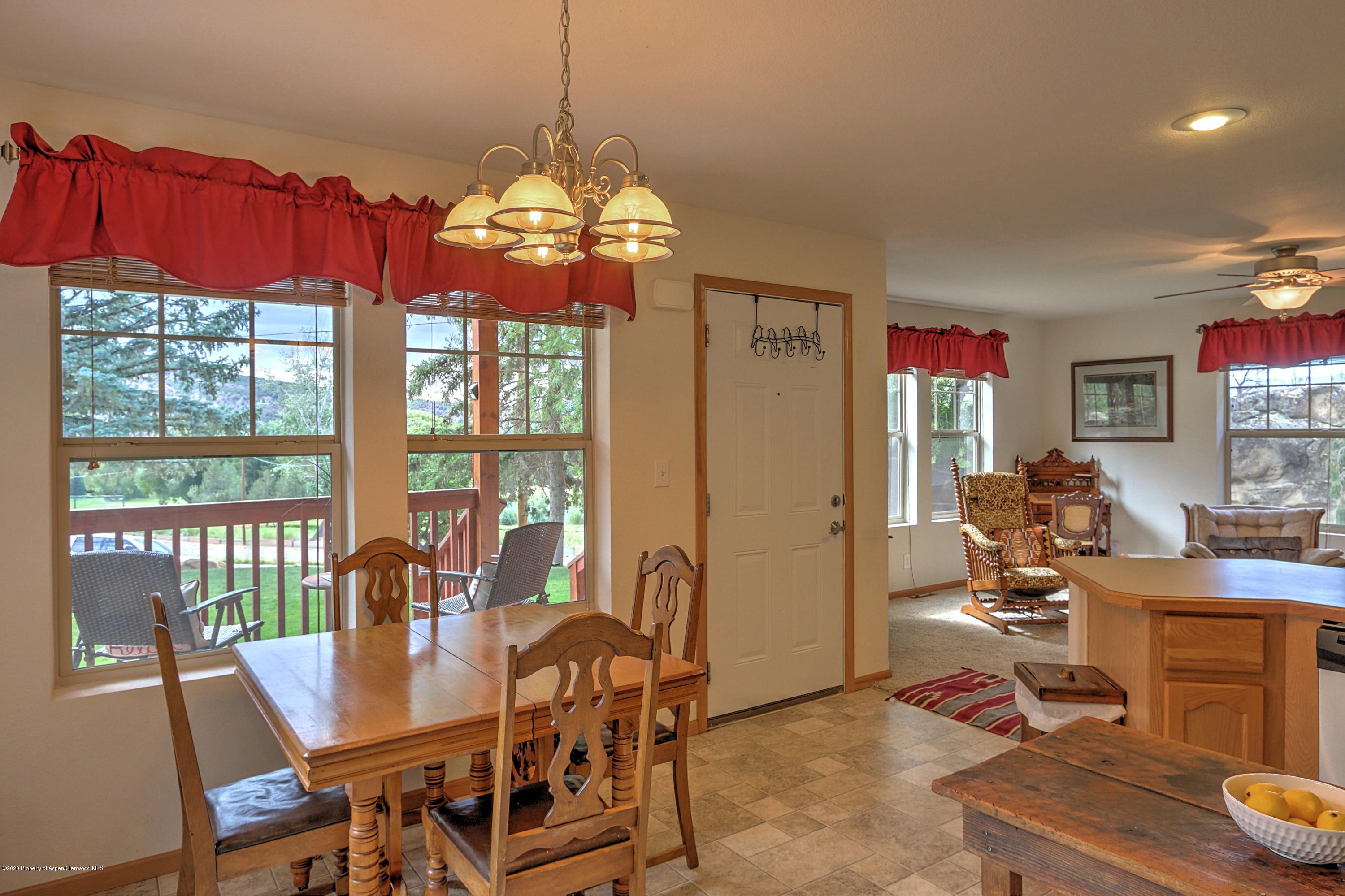 3045 Highway 325 Rifle, CO 81650 - Photo 8 of 35 a view of a dining room with furniture window and outside view