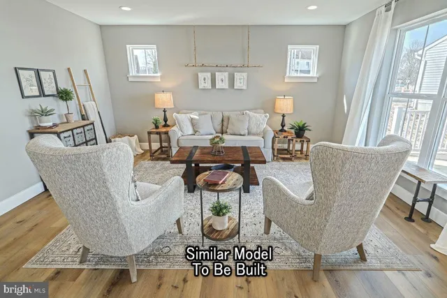 a living room with furniture a couch and a window