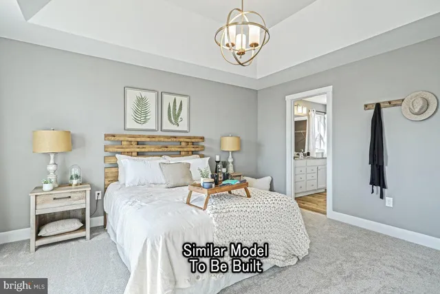 a bedroom with a bed and a table in it