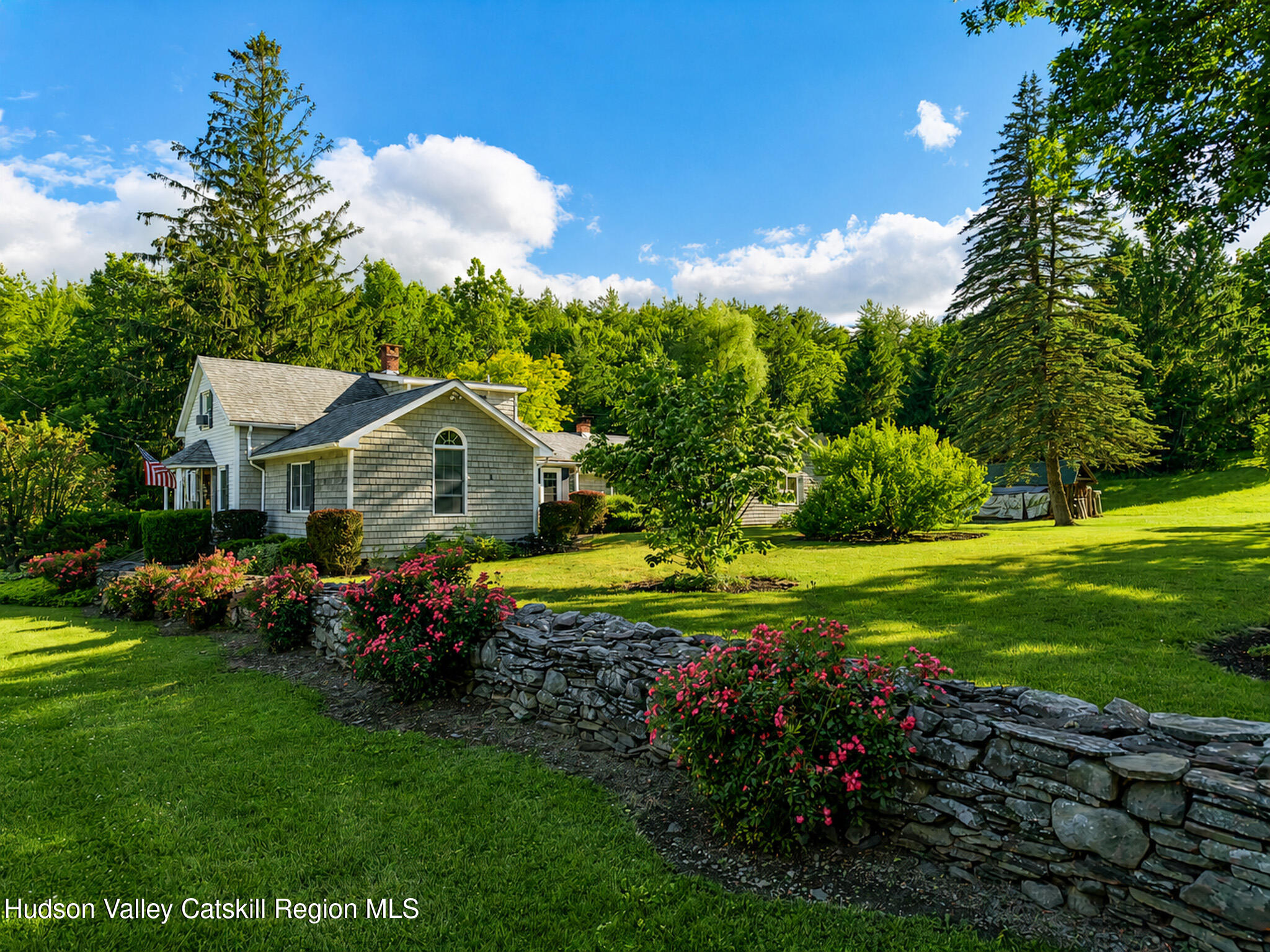 221 Camp Medusa Road Rensselaerville, NY 12120 - Photo 56 of 57 a front view of a house with garden
