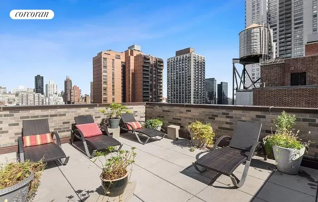 a outdoor view with a couch and tables