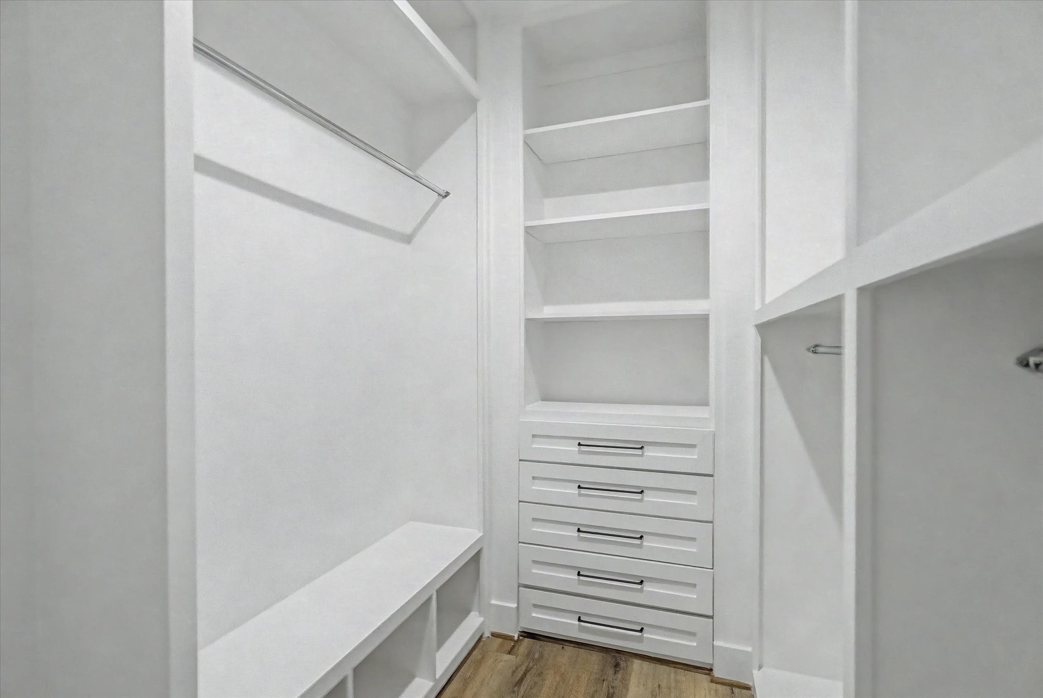 3806 Dreyfus Street Houston, TX 77021 - Photo 30 of 48 Custom primary closet featuring built-in drawers and ample hanging space.