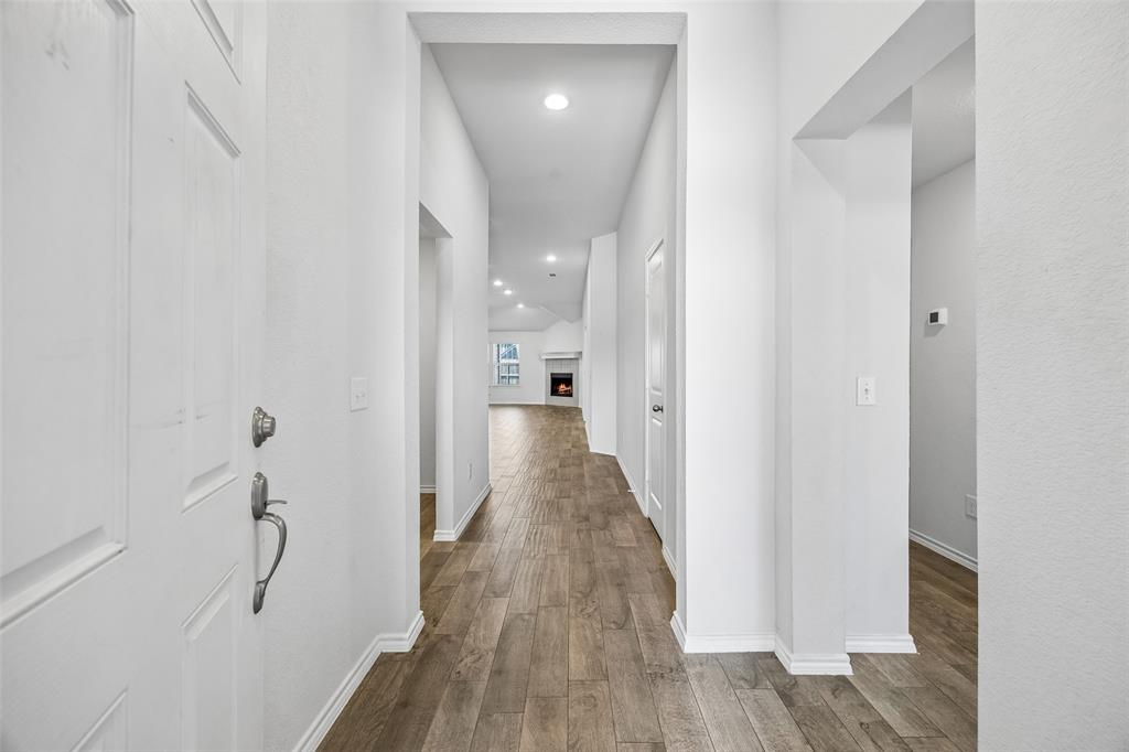 3807 Dogwood Road Melissa, TX 75454 - Photo 2 of 38 a view of a hallway with wooden floor and staircase