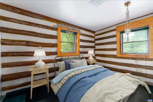 a view of a room with furniture and window