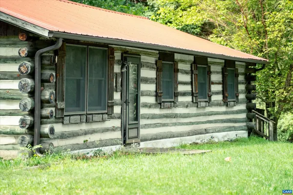 a balcony with trees in front of it