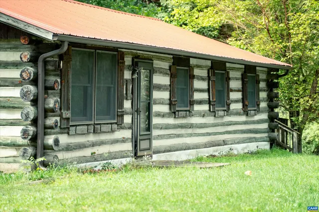 a balcony with trees in front of it