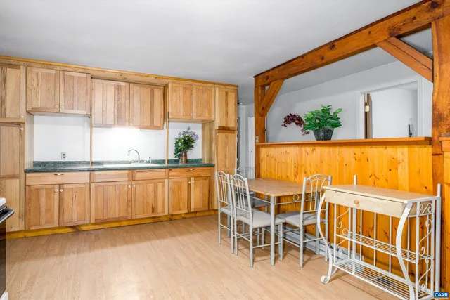 a view of a kitchen with an oven and cabinets