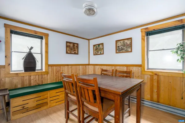 a view of a dining room with furniture and window
